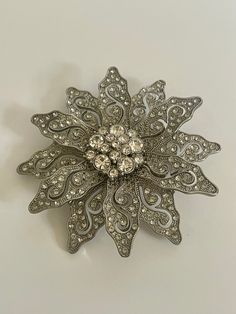 Vintage crystal or rhinestone floral silver brooch pin likely made in the 1990s. Beautiful  crystals or rhinestones in a flower style. Sustainable Jewerly This is vintage jewelry so there is some minor wear, discoloration, or imperfection. Please review all photos as they provide the best description. Silver Brooch Pin, Beautiful Crystals, Flower Style, Sustainable Jewelry, Silver Brooch, Saint Petersburg, Rhinestone Brooches, Vintage Crystal, Flower Fashion