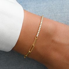 "Beautiful and trendy bracelet featuring half tennis bracelet and half paperclip bracelet design. It's perfect for layering or wearing along for a minimalist look! Matching Necklace Available! https://www.etsy.com/listing/1167555921/half-tennis-half-paperclip-necklace?click_key=3d130ca5c4a375b7dcc02011263b1e3c605354f0%3A1167555921&click_sum=be454552&ref=shop_home_active_4&frs=1 - - - D E T A I L S - - - * Made of 925 Sterling Silver * THICK plating of 14k Gold or Rhodium * Lobster Clasp Closure Half And Half Bracelet, Half Tennis Bracelet, Simple Diamond Ring, Paperclip Bracelet, Trendy Bracelet, Paperclip Necklace, Double Band Rings, Bracelet Tennis, Bracelets Design