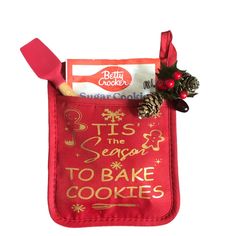 an oven mitt with a cookie in it and a candy bar on the side