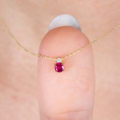 "Single Diamond 14K Solid Gold Ruby Necklace, Birthstone Gift Jewelry, Minimalist Round Ruby Necklace, Christmas Gift, Diamond Ruby Necklace Ruby is the birthstone of July. All of our products are carefully made of 14k Solid Gold, Real diamonds. F E A T U R E S * Made to Order. * Gold KT: 14K * Choice of Gold Color: Yellow Gold, Rose Gold, White Gold * Gem Stone: Genuine Diamond * Diamond-Cut: Round * Diamond Carat: 0.02 ct. * Ruby Carat: 0.30 ct. * Pendant Height: 5,65 mm / 0.22 inch * Pendant Width: 3,60 mm / 0.14 inch * Diamond Color-Clarity: G.VS Color, SI Clarity * Length: 14\", 16\", 18\", 20\", 22\", 24\" * Setting Type: Bezel Setting * Ready to Ship in 1-3 Business Days * 100% US sourced * 2 Years Warranty * Free Express International Shipping * Free returns within 14 days from the Ruby Gold Pendant, Ruby Pendant Design, Diamond Ruby Necklace, Ruby Necklace Designs, Gold Ruby Necklace, Ruby Pendant Necklace, Necklace Ruby, Ruby Necklace Pendant, Gold Jewelry Simple Necklace