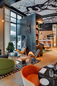 a living room filled with furniture and lots of windows