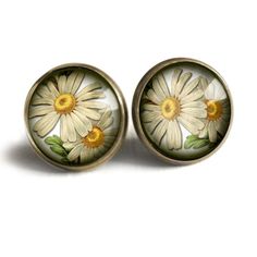 A Victorian botanical illustration of a daisy rests under a 5/8" glass cabochon.  This pretty floral earring features our signature sleek nickel free brass findings and wires. . Victorian Botanical, Thistle Earrings, Flower Vintage, Weiner Dog, Red Bead, Floral Earrings, Earrings Photo, Botanical Illustration, Daisy Flower