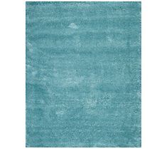 a blue rug with an area rug in the middle, and a white background on top