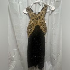 Vintage Gold Sequins Beaded Fitted Evening Dress For Night Out, Black Sequin Dress For Formal Holiday Occasions, Black Sequin Dress For Formal Holiday Events, Black Holiday Sequin Dress For Formal Occasions, Black Holiday Formal Sequin Dress, Holiday Black Sequin Formal Dress, Festive Black Sequin Dress, Festive Black Prom Dress, Elegant Black Embellished Sequin Dress