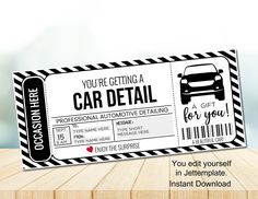 a car detailing coupon card sitting on top of a wooden table with the words you're getting a car detail