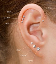 an ear is shown with three different types of piercings on the top and bottom