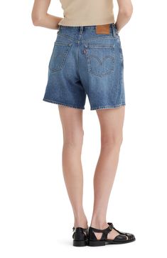 A relaxed A-line silhouette adds to the retro charm of cleanly styled mid-thigh shorts made from sturdy nonstretch denim. 6 1/2" inseam; 27" leg opening; 12" front rise; 14" back rise (size 29) Zip fly with button closure Five-pocket style 100% cotton Machine wash, tumble dry Imported Baggy Short Outfits, Classic High Rise Denim Jean Shorts, Relaxed Fit Medium Wash Shorts With Belt Loops, Classic Jean Shorts With Belt Loops, Levi's Straight Leg Jean Shorts With Pockets, Classic Rigid Denim Bottoms For Summer, Classic Denim Blue Jean Shorts For Spring, Classic Short Length Denim Bottoms, Medium Wash Relaxed Fit Jean Shorts With Belt Loops