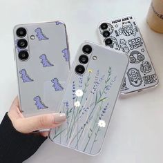 two phone cases with flowers on them, one is clear and the other is blue