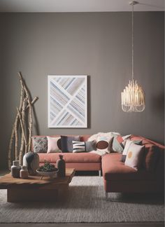 a living room filled with furniture and a large map hanging on the wall above it