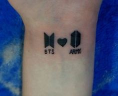 two tattoos on the wrist that say bt's army and bt's army