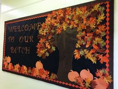 a bulletin board with fall leaves on it