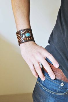 Two toned leather cuff with turquoise colored bead.Very  nice   cuff,go well with casual,or motorcycle outfit.Great  gift for  Valentine  Day.Easy  to close.the bracelet is 9.25" long2 snaps closure, first one is 2.5" circumferencesecond one is 2" circumferenceLooks amazing, sure to grab attention!JB Southwestern Brown Leather Cuff Bracelet, Rustic Turquoise Leather Bracelet, Leather Jewelry Diy, Gift For Valentine, Sherman Oaks, Leather Bracelets, Motorcycle Outfit, Leather Cuffs Bracelet, Leather Projects