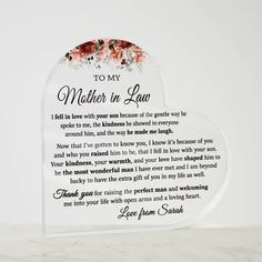 a heart shaped glass plaque with the poem to my mother in law