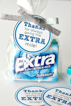 there are two stickers that say thank you for always going the extra mile and next to each other