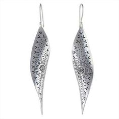 Wavy shapes are handcrafted of sterling silver capturing the beauty of a gentle breeze. Presented by Thailand's Wadarat Supasirisuk these dangle earrings celebrate the craftsmanship of Karen hill tribe artisans imprinted with floral motifs and dotted designs. Artistic Sterling Silver Teardrop Earrings, Sterling Silver Teardrop Jewelry With Artistic Design, Silver Teardrop Earrings With Artistic Design, Silver Artisan Earrings With Artistic Design, Artisan Silver Earrings With Artistic Design, Bohemian Silver Earrings With Artistic Design, Bohemian Sterling Silver French Hook Earrings, Unique Silver Earrings With Artistic Design, Artistic Sterling Silver Earrings