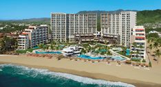 an aerial view of the resort and beach