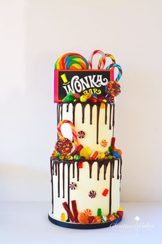 a three tiered cake decorated with candy and candies