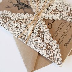 an open envelope with a lace doily on it