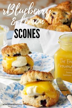 blueberry and lemon scones on a plate next to a jar of orange juice