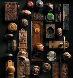 an assortment of door knobs and pulls on a black background