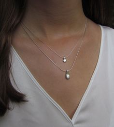 "This hand made teardrop pendant necklace has an effortless, earthy allure. The matte sterling silver pendant hangs at the base of a delicate sterling silver chain. This is the perfect necklace to pair with any casual outfit adding a bohemian vibe. Wear this alone, or layer it with your other favorites for a personalized eclectic look. ❉ F A C T S total length : 16\"/ 42 cm teardrop length: 1\"/ 2.54 cm teardrop width: 0.45\"/ 1.1 cm You will receive the necklace in a gift box ready to be given Delicate Teardrop Sterling Silver Charm Necklace, Everyday Teardrop Sterling Silver Charm Necklaces, Everyday Sterling Silver Teardrop Charm Necklaces, Everyday Sterling Silver Teardrop Charm Necklace, Minimalist Teardrop Pendant Drop Earrings For Everyday, Delicate Sterling Silver Drop Necklaces, Silver Drop Necklace With Delicate Chain And Teardrop Pendant, Delicate Sterling Silver Teardrop Pendant Charm Necklace, Silver Drop Necklace With Teardrop Pendant