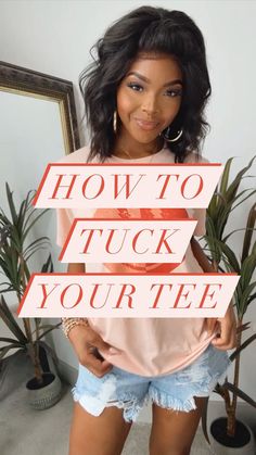 a woman holding up a sign that says how to tuck your tee