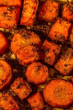 cooked carrots with seasoning on top in a baking dish, ready to be eaten