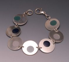 "This sterling silver bracelet features seven 3\\/4 inch \"Spots\" accented with navy, aqua and light blue resin. It is 7 3\\/4 inches long." Sterling Silver Blue Oyster Bracelet, Blue Sterling Silver Bracelet With Polished Finish, Blue Sterling Silver Bracelets With Polished Finish, Sterling Silver Bracelet, Sterling Silber, Sterling Silver Bracelets, Arm Band, 4 Inch, Silver Bracelet