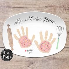 a personalized plate with two handprinted doughnuts and whisk