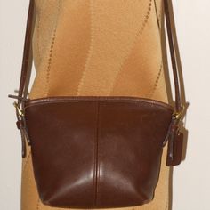 This Beautiful Coach Vintage Shoulder Bag Will Be Your Partner In Fashion. Glued To Your Side On All Occasions Making An Elegant Fashion Statement. You Will Love The Universal Appeal This Shoulder Bag Presents. Brand Coach Color: Brown Style: Shoulder Bag Material: Leather Features A 20" Shoulder Strap Measurements: 7wx7.5hx3 Cross-Top-Zip Fastening Spacious Interior With An Inner Zip Pocket Signature Logo Condition: Just Like New Imported Coach Brown Bucket Shoulder Bag, Coach Brown Leather Bucket Bag, Brown Coach Bucket Shoulder Bag, Classic Coach Crossbody Bucket Bag, Classic Coach Rectangular Bucket Bag, Coach Leather-lined Crossbody Bag, Coach Leather Crossbody Bag, Cross Top, Branding Coach