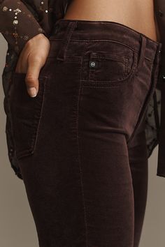 Denim, decoded: We’re digging denim in every corner of our closet. The AG Farrah Jeans offer a high-rise and bootcut leg, now in a velvet fabric. | AG Farrah High-Rise Bootcut Jeans: Velvet Edition by AG Jeans in Purple, Women's, Size: 27, Cotton/Rayon/Viscose at Anthropologie Velvet Jeans Outfit, Velvet Jeans, High Rise Bootcut Jeans, Ag Jeans, Modern Wardrobe, Blank Nyc, 50 Fashion, Premium Denim, Jean Outfits