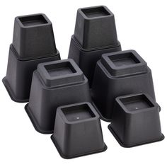 six black plastic square containers with lids on each one side and four smaller ones in the middle