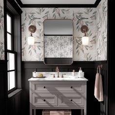 a bathroom with floral wallpaper and white vanity, mirror and lights on the wall