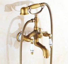 a faucet with two hoses attached to it and water running down the side