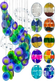 an image of colorful glass balls hanging from the ceiling in front of a white background