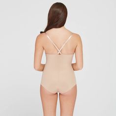 This versatile bodysuit is the ultimate solution for low-back dresses! The flawless-finish fabric is lightweight, cling-free, and offers 360 degrees of comfortable, single-layer shaping for a sleek, all-over feel. And, best of all? The innovative design features lightly padded, fit-flexible wireless cups and adjustable, convertible straps for a variety of styling options Micro-elastic Leotard With Lined Body, Fitted Backless Leotard With Built-in Bra, Solid Shapewear Leotard With Moderate Back Coverage, Fitted Elastane Leotard For Shapewear, Fitted Elastane Leotard Shapewear, Fitted Elastane Shapewear Leotard, Micro-elastic Full Coverage Bodysuit With Built-in Bra, Full Coverage Shaping Leotard With Built-in Bra, Supportive Shapewear With Lined Body