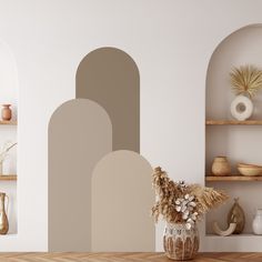 a vase filled with flowers sitting on top of a wooden table in front of a white wall