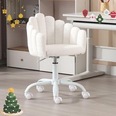 a white desk chair with wheels and a christmas tree