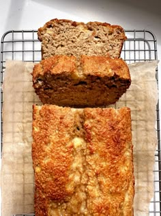 two slices of banana bread sitting on top of a cooling rack next to each other