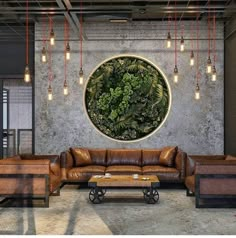 a living room filled with lots of furniture next to a large circular painting on the wall