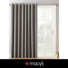 an open window with grey curtains in front of it and the words macy's written on