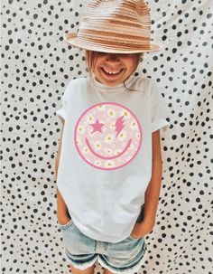 Thank you for visiting my shop! Please feel free to reach to me with anything you need! Best, Aly :) Distressed smile face toddler tee. Toddler Girl Clothes, Toddler Boy Clothes, Kids Shirts, Toddler Clothing, Toddler Shirts, Toddler Tshirts, Trendy Toddler Super comfy short-sleeve jersey t-shirt from 100% cotton. The tee is soft, durable, and bound to become the staple of your toddler's wardrobe. * 100% combed and ring-spun cotton * Fabric weight: 4.2 oz/yd² (142 g/m²) * Relaxed fit for extra c Fun White Printed Tops, Cute Printed White Shirt, White Top With Funny Print For Spring, Toddler Girl Tees, Toddler Graphic Tee, Toddler Boy Clothes, Toddler Girl Clothes, Kids Tees, Kids Tshirt