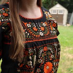 Mexican Floral Blouse Hand-Embroidered in San Gabriel Chilac, Puebla. Fresh, everlasting stunning blouse hand-embroidered in San Gabriel Chilac, Puebla.These traditional Mexican blouses are the perfect accessory for sunny days. Their cotton fabric allows for maximum breathability while the floral details elevate all outfits, both casual and formal! Hand embroidered in San Gabriel Chilac, Puebla, a town renowned for the authorship of traditional Mexican floral blouses 100% fresh cotton Hand-embro Traditional Mexican Outfit, Mexican Traditional Clothing, Mexican Blouses, Mexican Clothing, Floral Blouses, Multicolor Embroidery, Mexican Embroidery, Mexican Blouse, Mexican Outfit