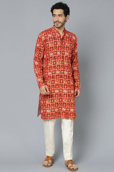 VASTRAMAY Men's Red Patola Print Ethnic Kurta Pyjama Set Elevate your ethnic wear collection with this classic kurta pyjama set. Features a red Patola print kurta with a mandarin collar, full sleeves, and knee length. Paired with comfortable cream colored viscose pants with an elasticated waistband. Perfect for festive occasions and family gatherings. Key Features Red Patola print ethnic kurta Mandarin collar Full sleeves Knee length Cream colored viscose pyjama Elasticated waistband Specificati Navratri Straight Kurta With Block Print, Festive Straight Kurta With Block Print, Traditional Churidar With Kalamkari Print For Designer Wear, Festival Designer Kurta With Bandhani Print, Designer Bandhani Print Kurta For Festivals, Cotton Sherwani With Traditional Patterns, Red Sherwani With Traditional Patterns For Festivals, Long Sleeve Cotton Churidar With Bandhani Print, Festive Block Print Straight Kurta