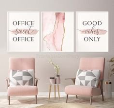 two pink chairs in front of a white wall with gold foil lettering on it, one is