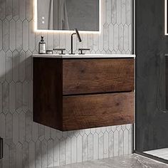 a bathroom with a sink, mirror and shower stall