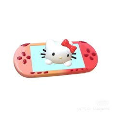 a hello kitty cell phone with a red bow on it's head is shown