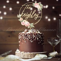 there is a chocolate cake with flowers on it and the nameplate reads, the kelpley