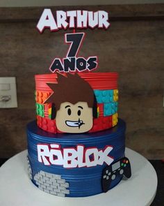 a birthday cake made to look like a video game character with legos on it