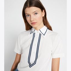 A classic polo is reimagined with a '70s influence. Crafted in lightweight mercerized cotton, the collared top is designed for wearing on and off the green. Fitted Polo Shirt With Striped Collar, Fitted Collared Preppy Polo Shirt, Preppy Fitted Collared Polo Shirt, Fitted Preppy Collared Polo Shirt, Fitted Preppy Polo Shirt For Spring, Spring Fitted Preppy Polo Shirt, Spring Preppy Fitted Polo Shirt, Classic Polo Shirt With Contrast Collar For Summer, Spring Polo Shirt With Contrast Collar